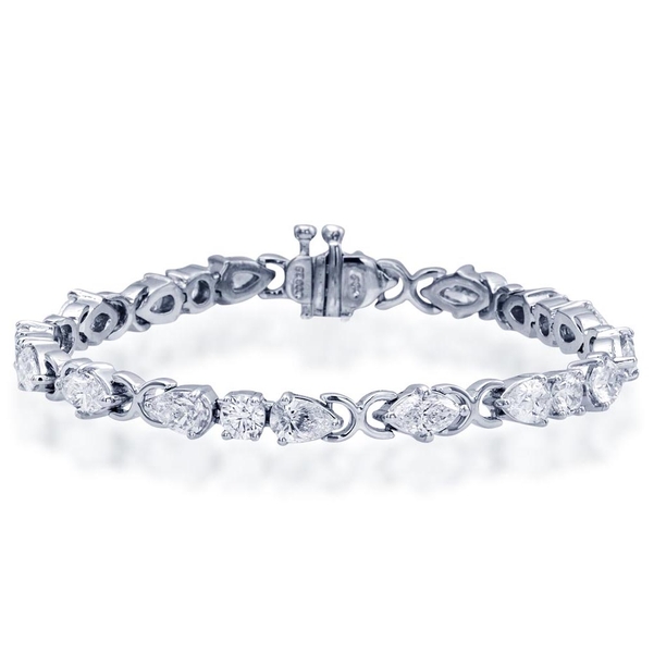 single row bracelet features, individually selected, 10 pear shaped, 6 marquise and 5 round diamonds handcrafted in pure platinum.jpg