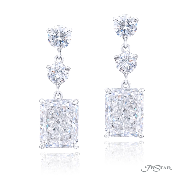 Diamond drop earrings featuring GIA certified radiant diamond centers hung by additional round diamonds.1199-089