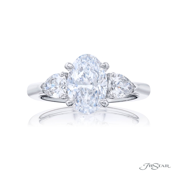2.01 ct. GIA certified oval diamond center embraced by two additional pear shaped diamonds. 7264-038