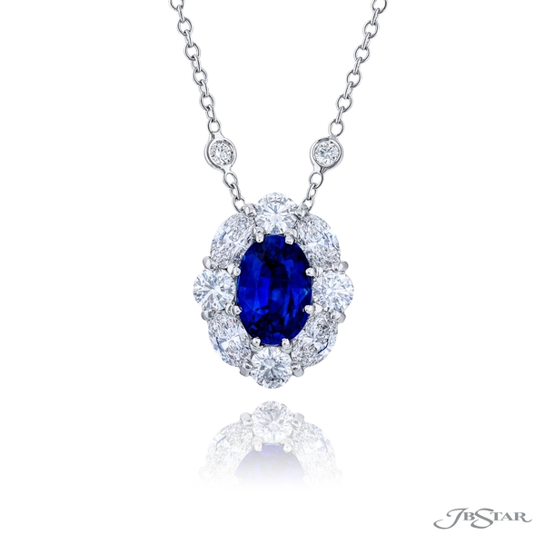 Sapphire and diamond pendant featuring a 3.04 ct. certified vivid oval-cut sapphire embraced by perfectly matched round and oval diamonds. 3321-001