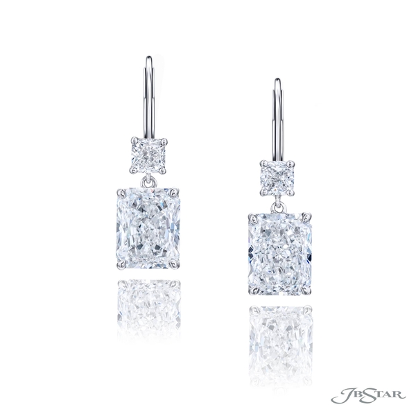 Diamond earrings featuring GIA certified radiant diamond centers hung by additional cushion diamonds. 1199-122