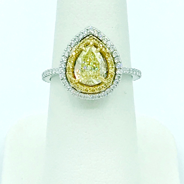 fancy yellow oval diamond halo yellow and white gold ring