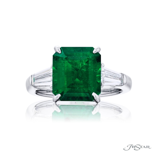 Emerald ring featuring a 5.00 ct. GRS certified octagonal-cut emerald center embraced by two tapered baguette diamonds.4398-143