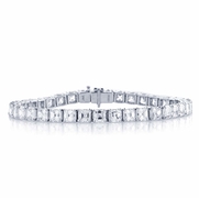 39 beautifully matched square emerald cut diamonds in a four prong setting.jpg
