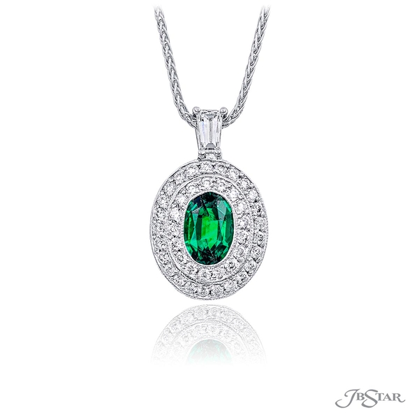 Emerald and diamond pendant featuring a 1.03 ct. oval emerald center encircled by a double row of micro pave diamonds hung by a tapered baguette diamond. 0202-017