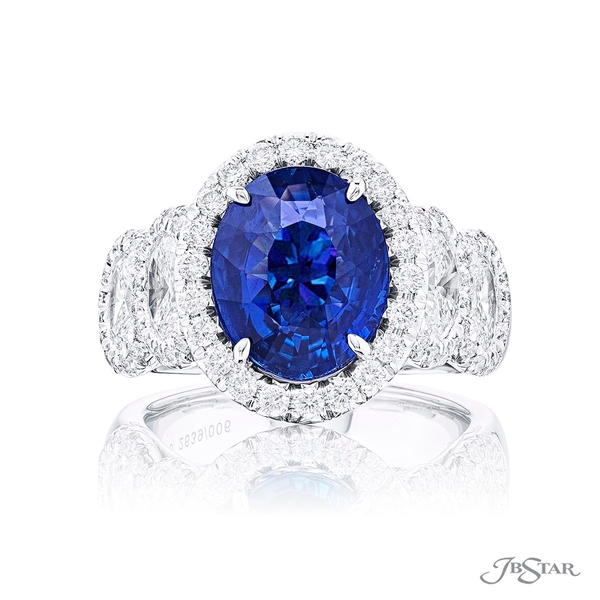 Sapphire and diamond ring featuring a 5.01 ct. certified oval sapphire center embraced by round diamonds in a micro pave setting.2639-006