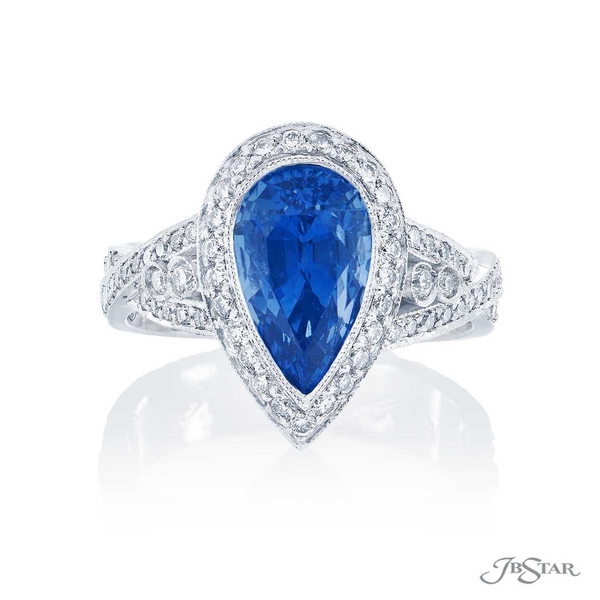 Sapphire and diamond ring featuring a 3.86 ct. pear-shape blue sapphire in a stunning vintage design with round diamonds.1334-003