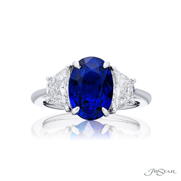 Sapphire and diamond ring featuring a gorgeous 4.53 ct. certified oval sapphire embraced between two half moon diamonds.4664-299