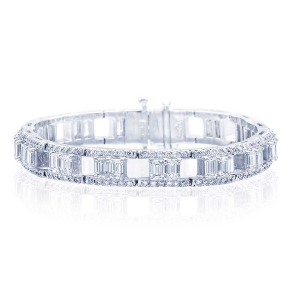 platinum bracelet is uniquely designed with perfectly matched emerald-cut diamonds set in a track of round diamonds.jpg