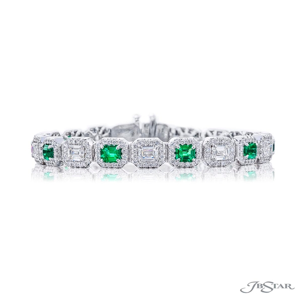 Emerald and diamond bracelet featuring 10 emerald-cut diamonds and 10 emerald-cut emeralds edged in round diamond pave. 1964-002