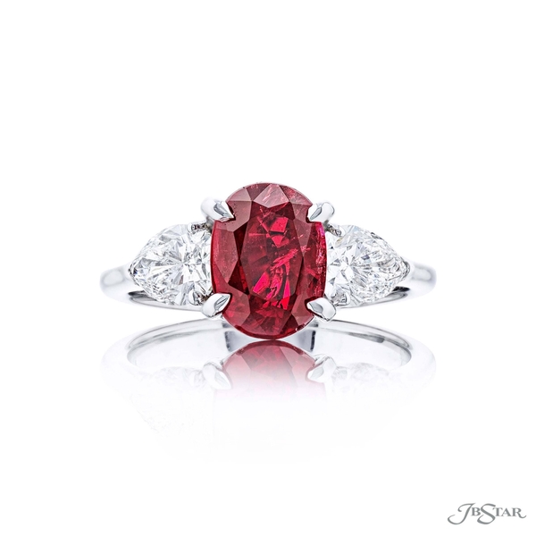 Ruby and diamond ring featuring a 3.13 ct. certified no-heat oval Burma ruby center embraced by 2 pear shaped diamonds.7264-014