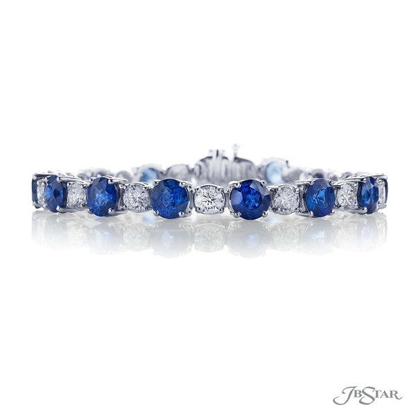 Bracelet featuring round blue sapphires and round diamonds in an alternating design handcrafted in pure platinum. 1385-003