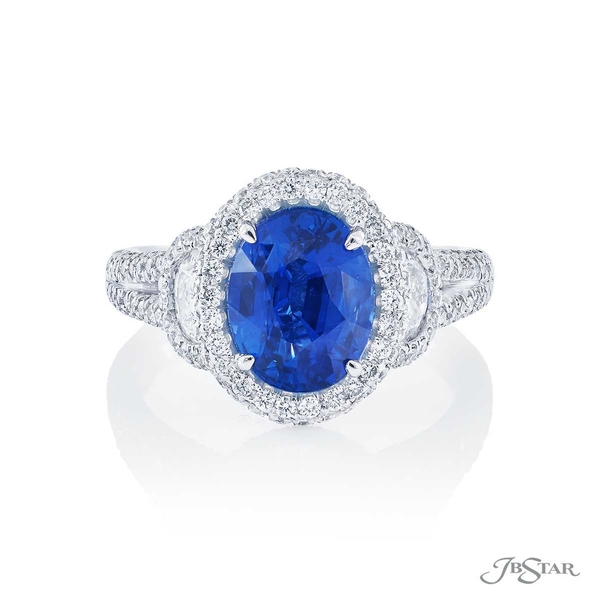 Sapphire and diamond ring featuring a 3.22 ct. oval sapphire center embraced by half moon diamonds in a micro pave setting.1309-004