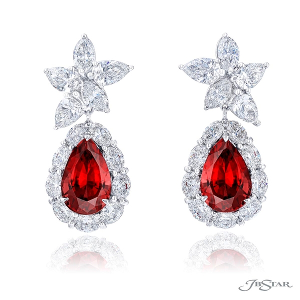 Ruby and diamond drop earrings featuring 5.64 cttw. Burmese pear shaped rubies encircled by oval diamonds.0512-055