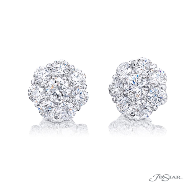Diamond stud earrings featuring 2 GIA certified round diamonds encircled by round diamonds. 2719-021