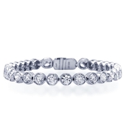 Diamond bracelet in a classic straight line style with 32 round diamonds bezel set in platinum.jpg