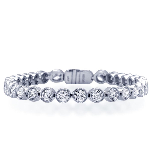 Diamond bracelet in a classic straight line style with 32 round diamonds bezel set in platinum.jpg