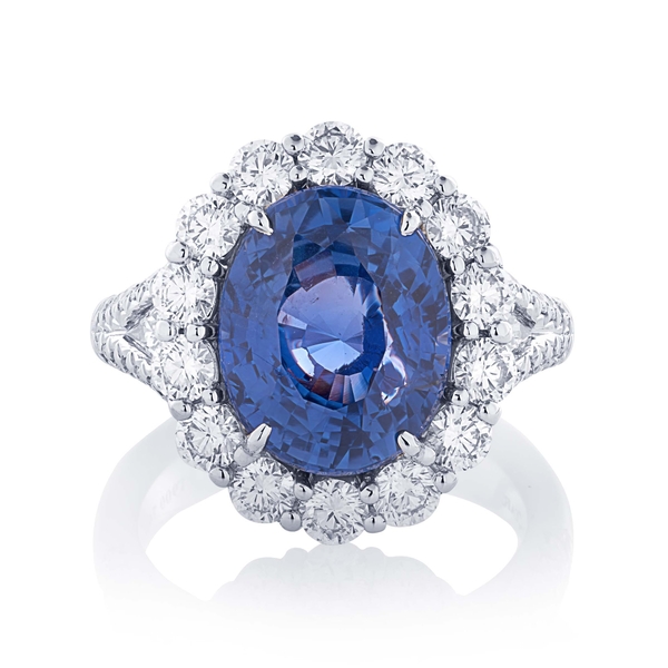6.71 no-heat oval Burma sapphire halo diamond ring.jpg
