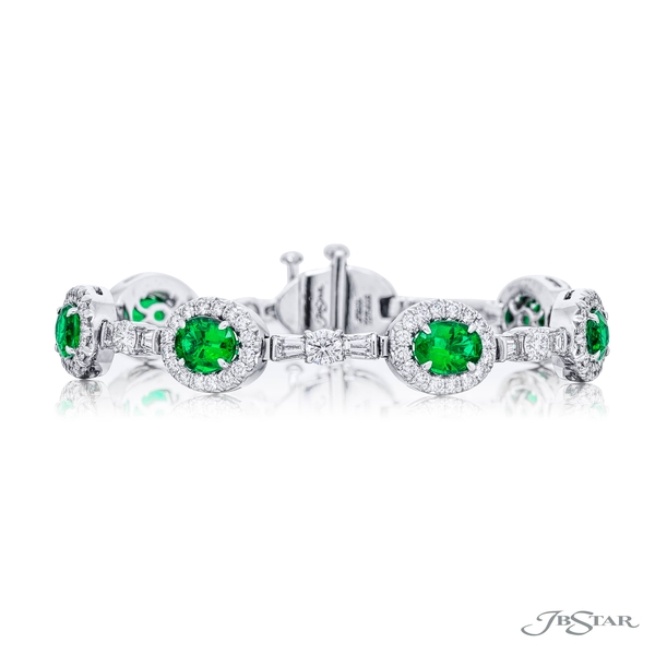 Emerald and diamond bracelet featuring beautiful oval green emeralds in a micro-pave setting connected by tapered baguette and round diamonds. 7275-006