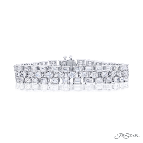 Diamond bracelet featuring 3 rows of emerald-cut and oval diamonds in a shared prong setting. 5944-001
