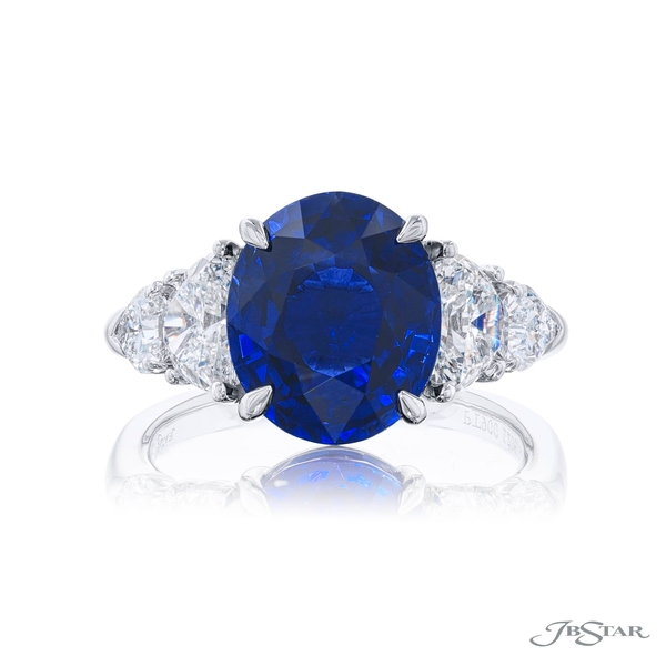 Sapphire and diamond ring featuring a 5.96 ct. GRS certified oval sapphire embraced half-moon and 2 shield diamonds.1206-022