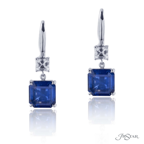 Sapphire and diamond drop earrings featuring 4.77 cttw emerald cut sapphires hung by matching square emerald cut diamonds. 1199-063