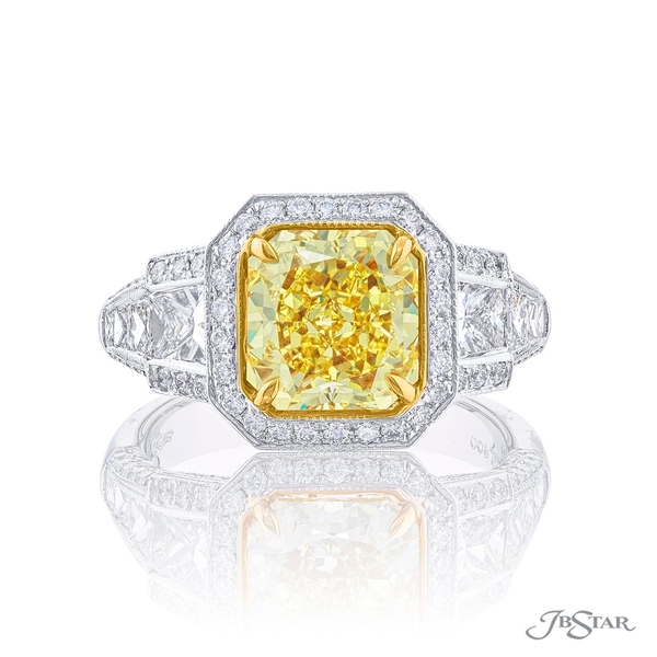 2.75 ct. GIA certified radiant cut fancy intense yellow diamond center embraced by trapezoid and princess cut diamonds on the shank set in micro pave. 2433-002