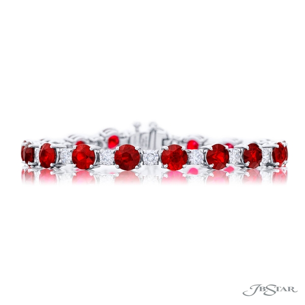 Ruby and diamond bracelet featuring 17 round Burmese rubies encircled by brilliant round diamonds in a shared prong setting.1067-012
